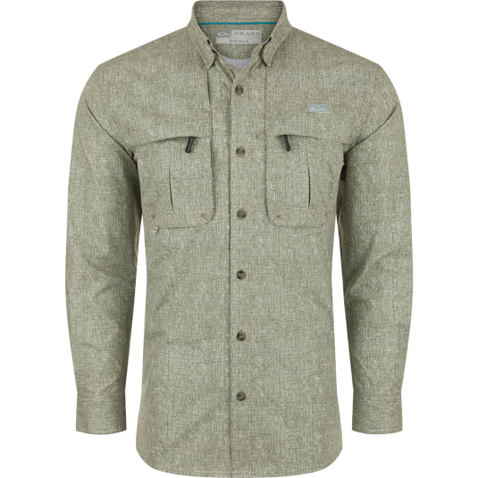 A Drake Heritage Heather Shirt L/S, a long-sleeved shirt with pockets. Made of 100% polyester micro mesh for natural cooling, moisture-wicking, and quick-drying. Features include a hidden button-down collar, vented cape back, and two front chest pockets. Perfect for performance on the water or at the office.