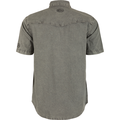 Back view of the Cinco Ranch Western Acid Washed Short Sleeve Shirt, highlighting its vented Western back cape and faux pearl snap buttons.