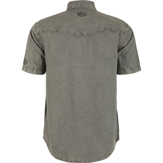 Back view of the Cinco Ranch Western Acid Washed Short Sleeve Shirt, highlighting its vented Western back cape and faux pearl snap buttons.