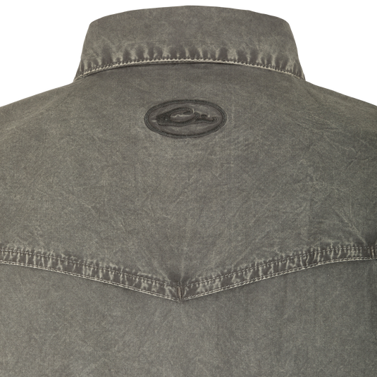 Cinco Ranch Western Acid Washed Short Sleeve Shirt with faux pearl snaps, vented back, and hidden button-down collar, highlighting its unique acid wash texture and Western style.