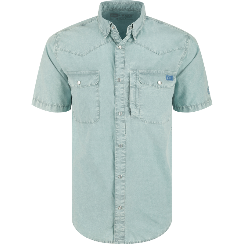 Cinco Ranch Western Acid Washed Short Sleeve Shirt with snap buttons, two flap pockets, utility pocket, and western yoke, ideal for versatile comfort and style.