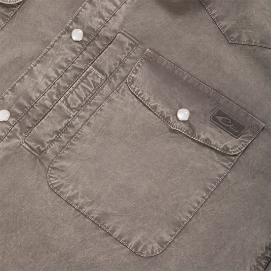 Close-up of Cinco Ranch Western Solid Acid Wash Long Sleeve Shirt showing flap pocket with pearl snap, brand label, and contrasting topstitching.