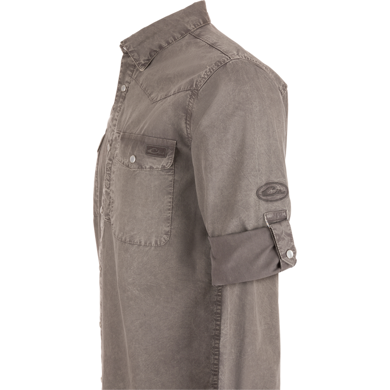 Cinco Ranch Western Solid Acid Wash Long Sleeve Shirt on mannequin; features snap-closure chest pockets, fold-over collar, rolled-up sleeves, highlighting its rugged, versatile design.