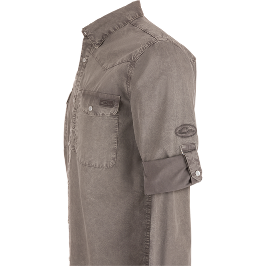 Cinco Ranch Western Solid Acid Wash Long Sleeve Shirt on mannequin; features snap-closure chest pockets, fold-over collar, rolled-up sleeves, highlighting its rugged, versatile design.