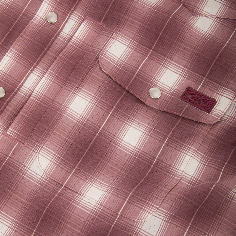 Close-up of the Drake Cinco Ranch Western Plaid Long Sleeve Shirt, highlighting its faux pearl snap button and plaid micro-mesh fabric designed for performance and comfort.