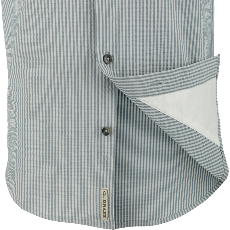 Frat Seersucker Striped Button-Down Short Sleeve Shirt close-up, highlighting its button and seersucker texture, featuring moisture-wicking performance fabric with hidden button-down collar design.