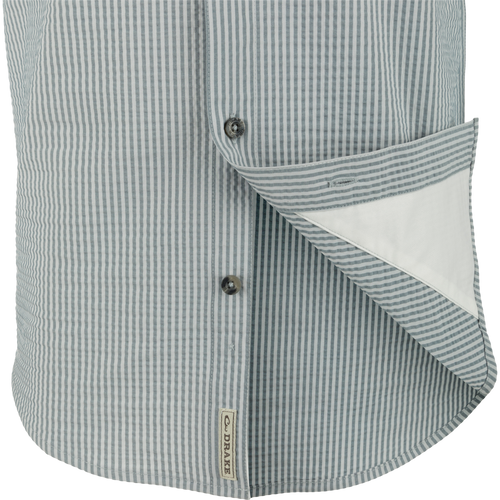 Frat Seersucker Striped Button-Down Short Sleeve Shirt close-up, highlighting its button and seersucker texture, featuring moisture-wicking performance fabric with hidden button-down collar design.