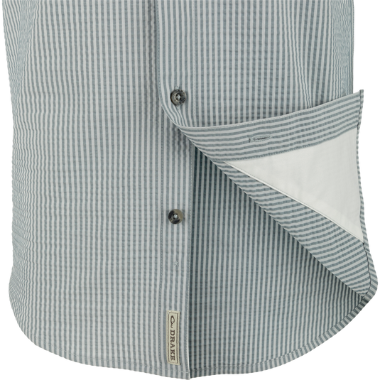 Frat Seersucker Striped Button-Down Short Sleeve Shirt close-up, highlighting its button and seersucker texture, featuring moisture-wicking performance fabric with hidden button-down collar design.