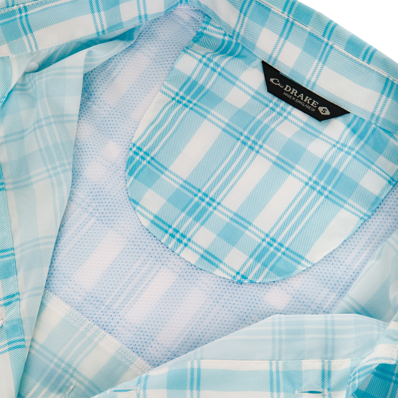Frat Faded Plaid Button-Down Short Sleeve Shirt with vented cape back, button-through flap chest pockets, and sculpted hem, ideal for active outdoor pursuits.