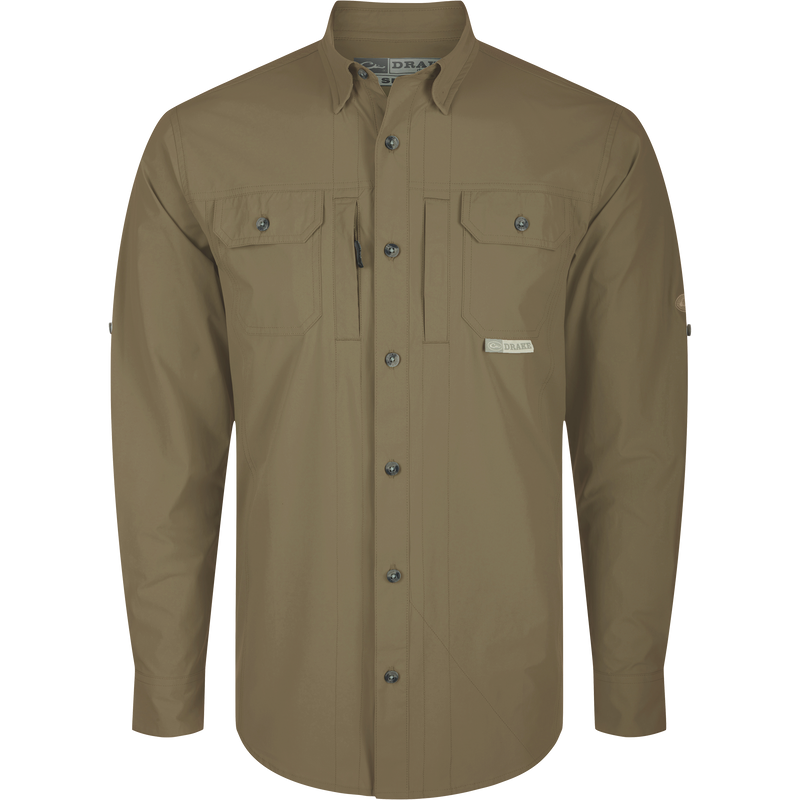 A long-sleeved Wingshooter Trey Shirt with button-down collar, flap chest pockets, and vented cape back, designed for performance and comfort.