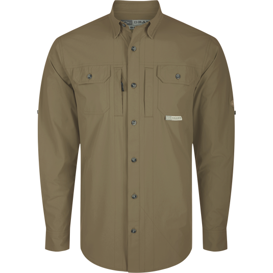 A long-sleeved Wingshooter Trey Shirt with button-down collar, flap chest pockets, and vented cape back, designed for performance and comfort.