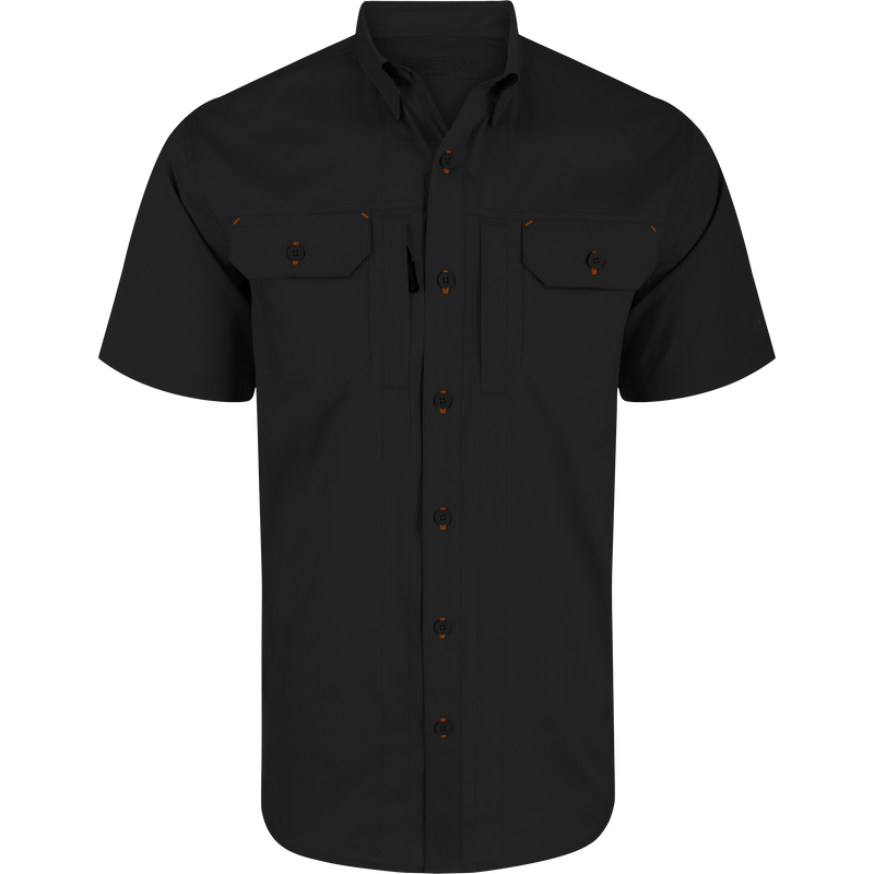 Wingshooter Trey Solid Short Sleeve Shirt featuring orange buttons, button-down collar, vented cape back, and dual flap chest pockets with hidden closures for versatile wear.