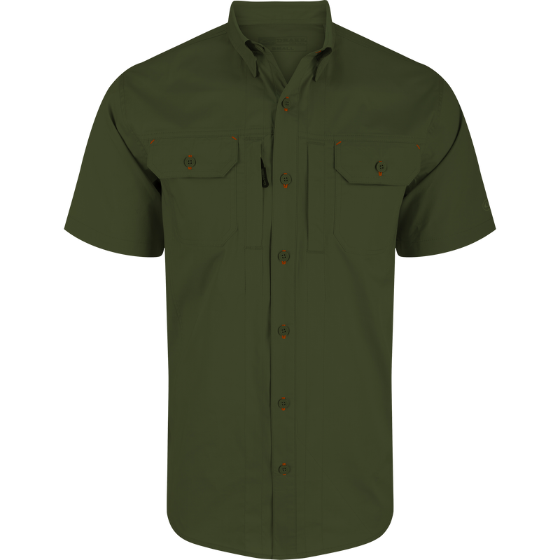 Wingshooter Trey Solid Short Sleeve Shirt featuring a soft cotton blend, button-through flap chest pockets, hidden button-down collar, and vented cape back for enhanced comfort and movement.