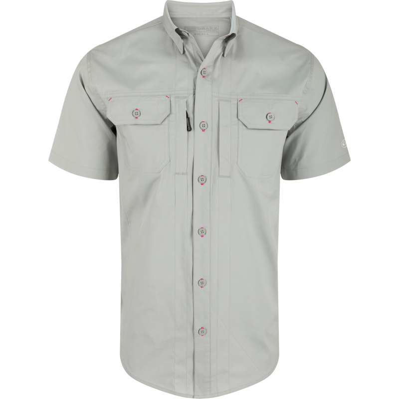 Wingshooter Trey Solid Short Sleeve Shirt with button-down collar, vented back, and chest pockets, showcasing a button detail, ideal for outdoor activities.