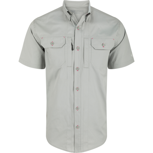 Wingshooter Trey Solid Short Sleeve Shirt with button-down collar, vented back, and chest pockets, showcasing a button detail, ideal for outdoor activities.
