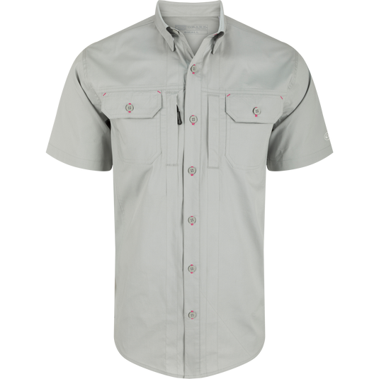 Wingshooter Trey Solid Short Sleeve Shirt with button-down collar, vented back, and chest pockets, showcasing a button detail, ideal for outdoor activities.