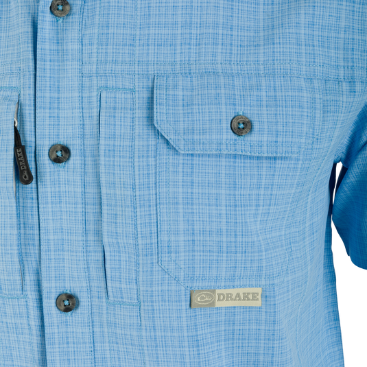 Wingshooter Trey Cross Hatch Short Sleeve Shirt with vented back, hidden button-down collar, and two chest pockets, showcasing premium performance features for outdoor activities.