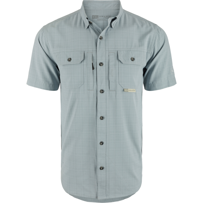 Wingshooter Trey Cross Hatch Short Sleeve Shirt, showcasing a close-up of its button-down collar, short sleeves, and flap chest pockets, highlighting performance-focused design.