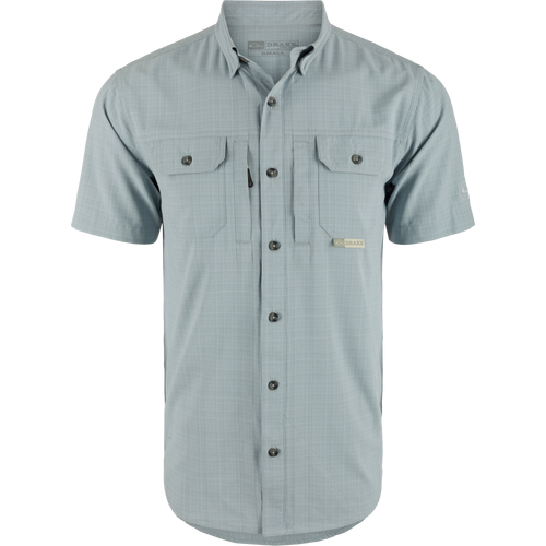 Wingshooter Trey Cross Hatch Short Sleeve Shirt, showcasing a close-up of its button-down collar, short sleeves, and flap chest pockets, highlighting performance-focused design.