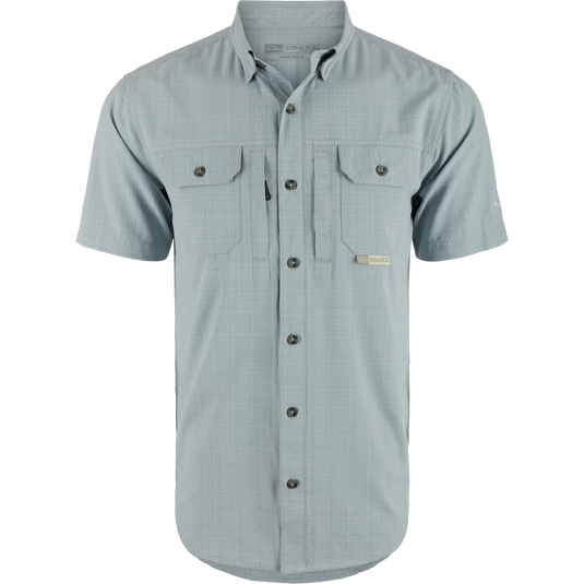 Wingshooter Trey Cross Hatch Short Sleeve Shirt, showcasing a close-up of its button-down collar, short sleeves, and flap chest pockets, highlighting performance-focused design.