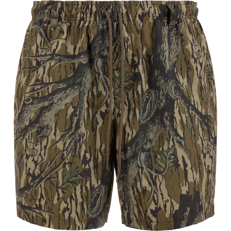 Dock Short 6: duck camo swim trunks with elastic waistband, external drawstring, and multiple pockets, designed for durability and quick-drying performance.