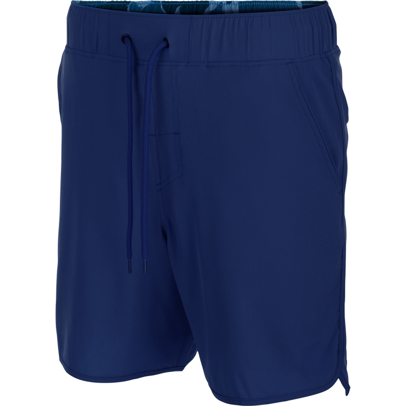 Drake Commando Lined Volley Short 7in with elastic waistband, scalloped hem, and built-in liner, featuring front slash and zippered back pockets.