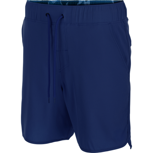 Drake Commando Lined Volley Short 7in with elastic waistband, scalloped hem, and built-in liner, featuring front slash and zippered back pockets.
