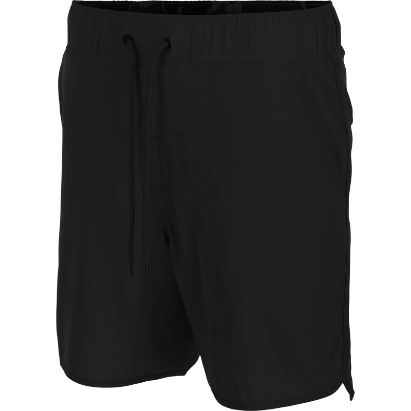 Commando Lined Volley Short 7in with elastic waistband, adjustable drawstring, scalloped hem, two front slash pockets, and back zippered pockets, showcasing versatile design and quick-dry features.