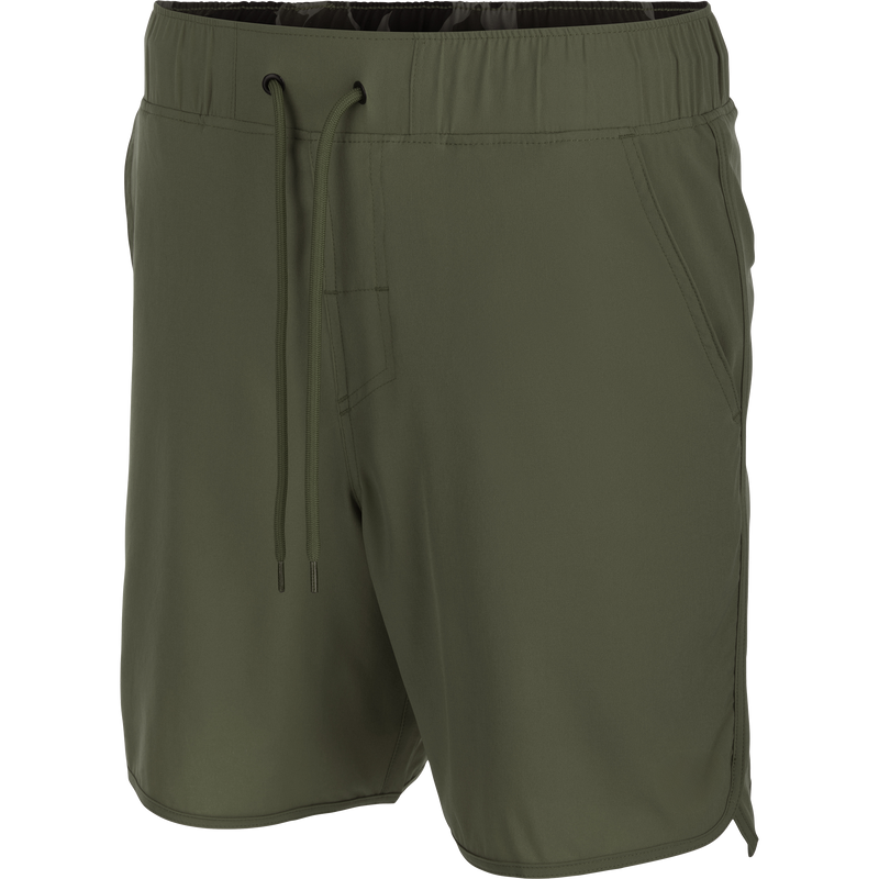Commando Lined Volley Short 7in, featuring a scalloped hem, back zippered pockets, and an elastic waistband with drawstring, ideal for versatile, active wear.