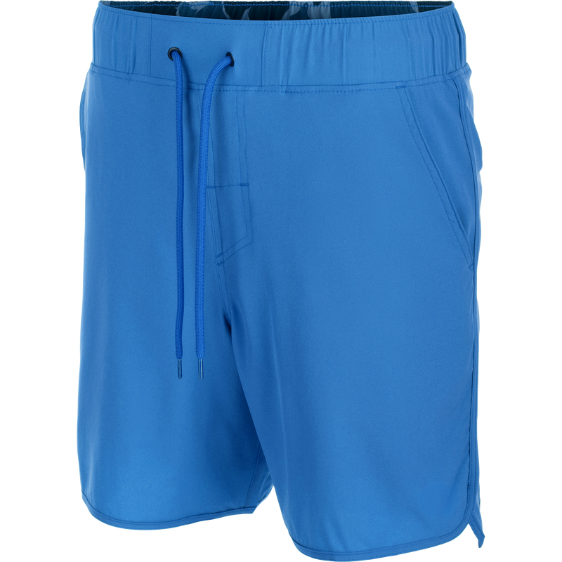 Drake Commando Lined Volley Short 7 with scalloped hem, elastic waistband, adjustable drawstring, slash pockets, and hidden zipper back pockets, showcasing versatility and functionality.