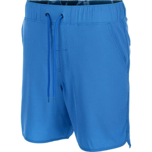 Drake Commando Lined Volley Short 7 with scalloped hem, elastic waistband, adjustable drawstring, slash pockets, and hidden zipper back pockets, showcasing versatility and functionality.