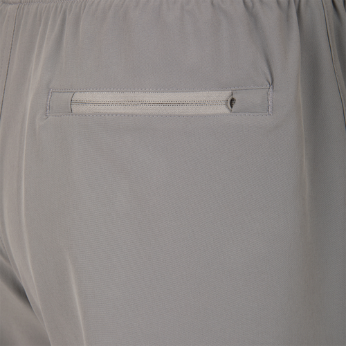 Drake Commando Lined Volley Short 7 with built-in liner, adjustable waistband, and moisture-wicking fabric, featuring front and back pockets with zippers.