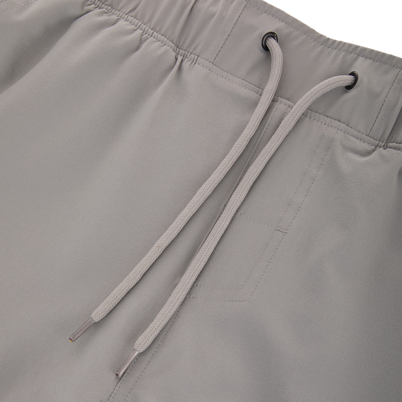 Commando Lined Volley Short 7in, featuring scalloped hem, elastic waistband with drawstring, two front slash pockets, and built-in quick-dry liner with Drake Camo print.