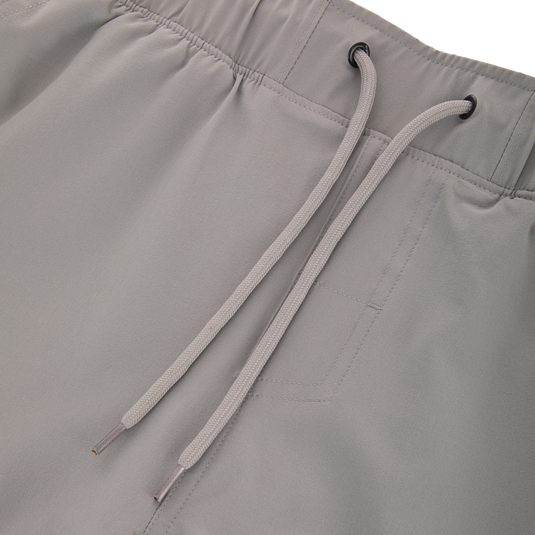 Commando Lined Volley Short 7in, featuring scalloped hem, elastic waistband with drawstring, two front slash pockets, and built-in quick-dry liner with Drake Camo print.