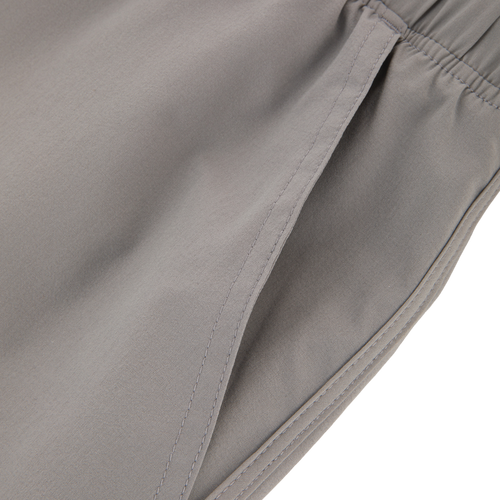 Commando Lined Volley Short 7in with built-in liner, elastic waistband, and pockets, designed for versatility and quick drying, ideal for active and casual wear.