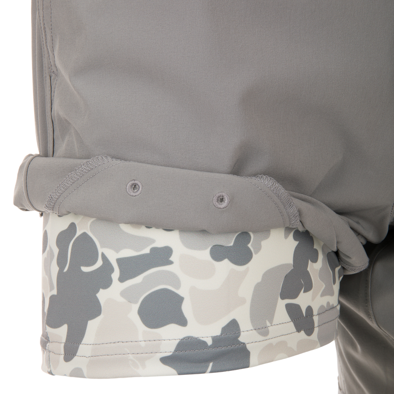 Drake Commando Lined Volley Short 7 showcasing elastic waistband, drawstring, scalloped hem, and zippered back pockets. Designed with quick-dry and moisture-wicking features.