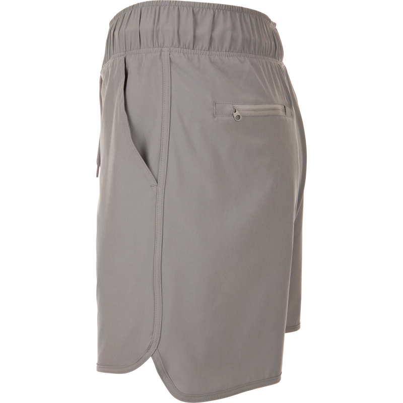 Commando Lined Volley Short 7in with built-in liner, elastic waistband, adjustable drawstring, scalloped hem, and zippered back pockets, ideal for versatile outdoor activities.