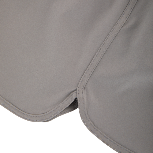 Commando Lined Volley Short 7in with elastic waistband, drawstring, scalloped hem, front slash pockets, and hidden zippered back pockets, ideal for versatile outdoor activities.