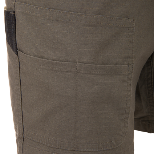 Close-up of the 9 Pocket Ripstop Short, showcasing the durable ripstop fabric and reinforced thigh cargo pocket, ideal for outdoor adventures and gear storage.