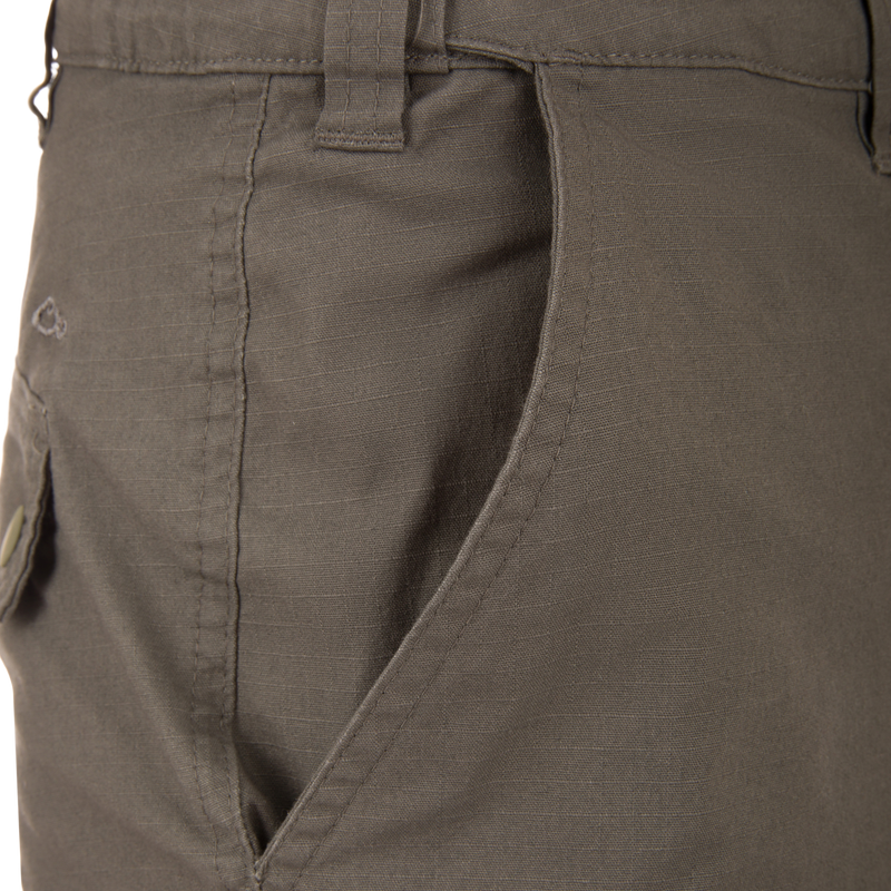 Front pocket view of the Drake 9 Pocket Ripstop Short, showcasing stitching, waistband belt loop, and durable design for versatile outdoor adventures.