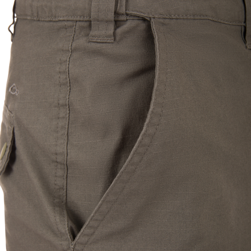 Front pocket view of the Drake 9 Pocket Ripstop Short, showcasing stitching, waistband belt loop, and durable design for versatile outdoor adventures.