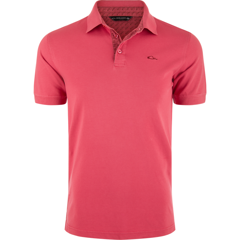 Pique Logo Polo features a classic three-button placket with ribbed collar and cuffs, embroidered Drake duck logo on chest, emphasizing modern performance and timeless style.