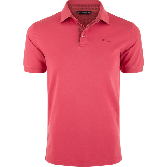 Pique Logo Polo features a classic three-button placket with ribbed collar and cuffs, embroidered Drake duck logo on chest, emphasizing modern performance and timeless style.