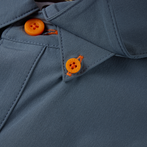 Close-up of the Lake Shore Performance Short Sleeve Shirt's button, highlighting the durable construction and technical features ideal for outdoor activities.