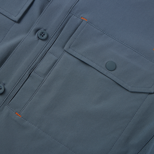 Lake Shore Performance Short Sleeve Shirt featuring a close-up of its button-through flap chest pocket and Magnattach closure, showcasing technical design and functionality.