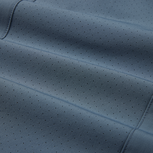 Close-up of Lake Shore Performance Short Sleeve Shirt fabric, highlighting its lightweight, stretchable polyester/spandex blend designed for outdoor activities with added technical features.