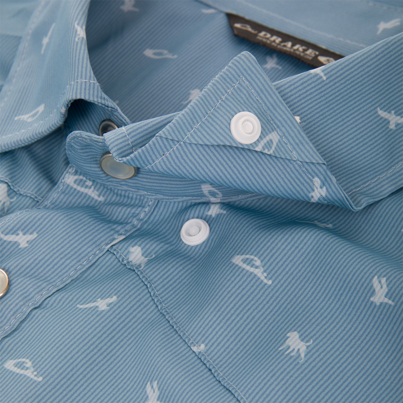 Close-up of Drake Cinco Ranch Western Short Sleeve Shirt featuring marine silhouettes, faux pearl snaps, vented back cape, and snap button chest pockets with Magnattach closure.