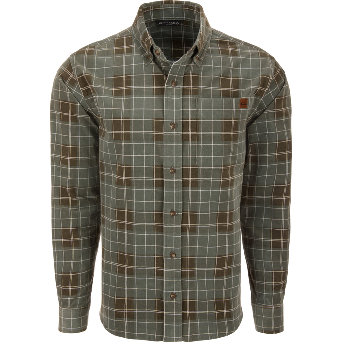 Mid-Wale Corduroy Shirt on mannequin, featuring a green and brown plaid pattern, button-down collar, chest pocket, and sculpted hem for versatile styling.