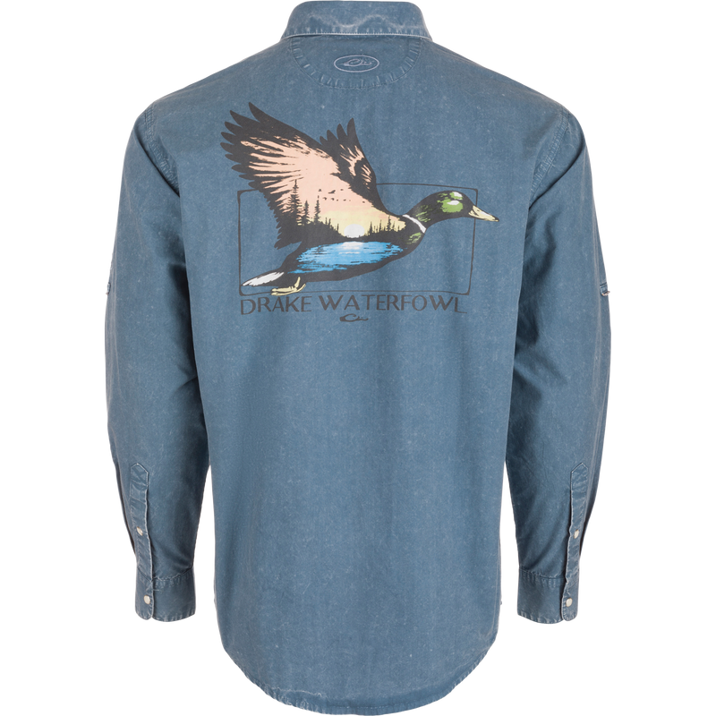 Back view of the Cinco Ranch Cotton Acid Wash Graphic Shirt featuring a flying duck graphic with sunset, treeline, water, and Purewhitelaneshop text.