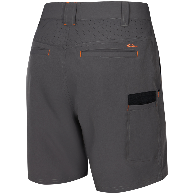 Lake Shore Performance Short featuring water-repellent fabric, laser-punched yoke, zippered cargo pocket, and reinforced plier’s pocket, ideal for active outdoor pursuits.